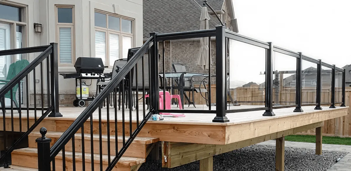 Handrail installation on a deck staircase for safety and code compliance in Lowell, MA