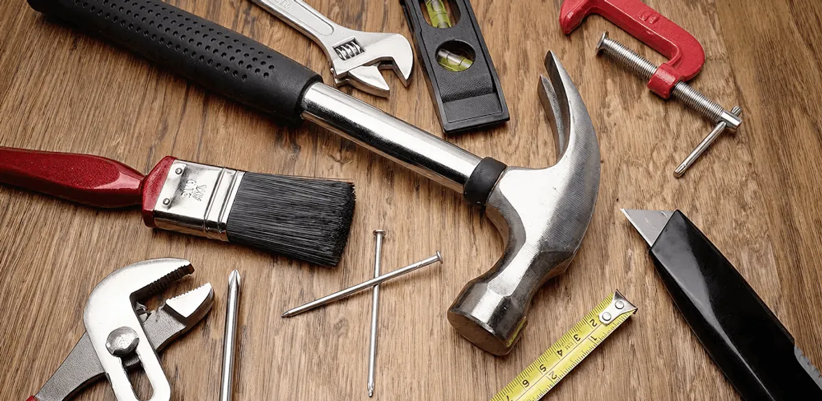 Handyman tools laid out for home repair and maintenance work in Lowell, MA